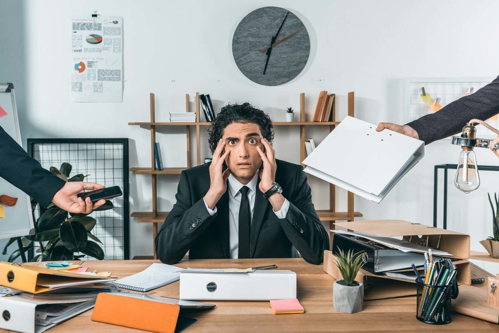 Stressed-overworked-businessman-missing-deadline