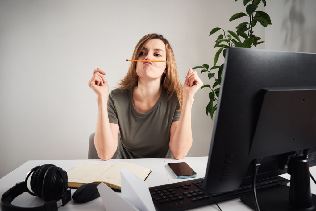 A woman struggling with diagram procrastination